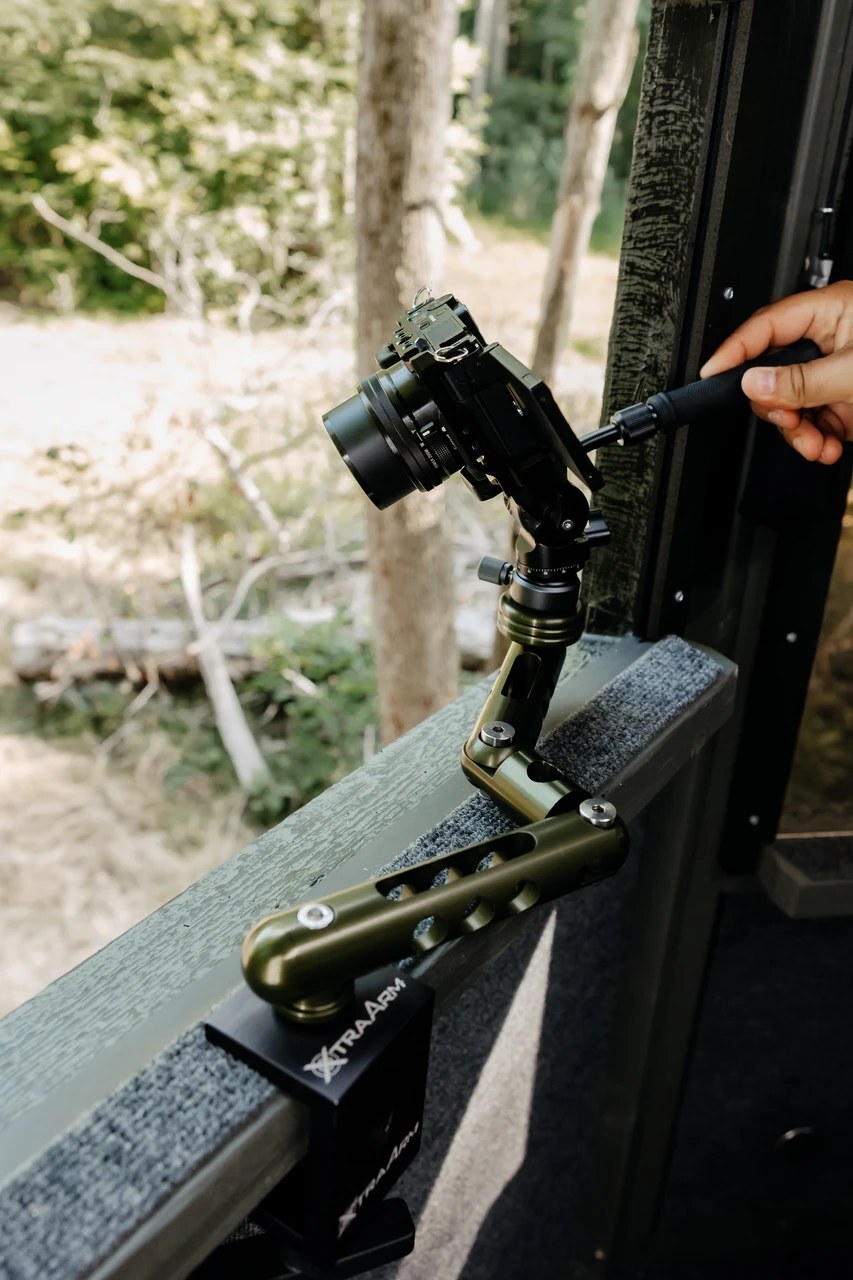The arm clamps straight to the window ledge and sets to the height of the opening, not the floor.
